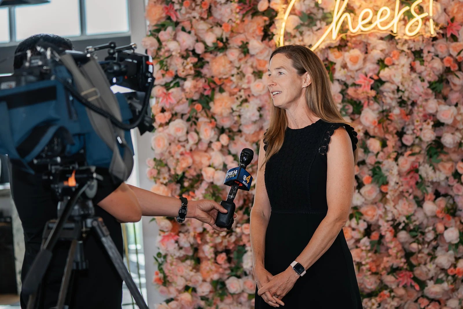 Corporate employee gets interviewed during an education event.